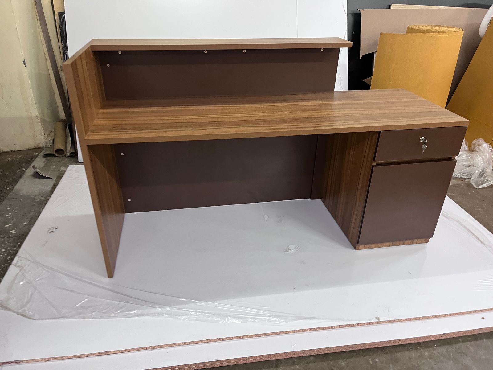 Reception Table Made In Engineered Wood with Matte Grey & King Walnut Laminate and Inlaid Brass Strip Detailing, Built In Storage