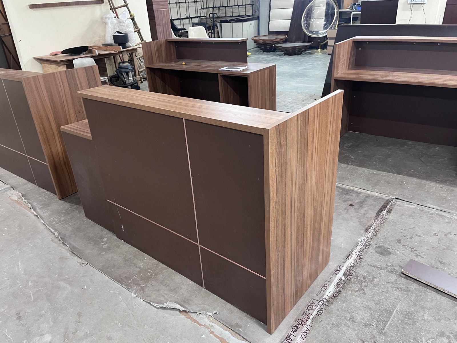Reception Table Made In Engineered Wood with Matte Grey & King Walnut Laminate and Inlaid Brass Strip Detailing, Built In Storage