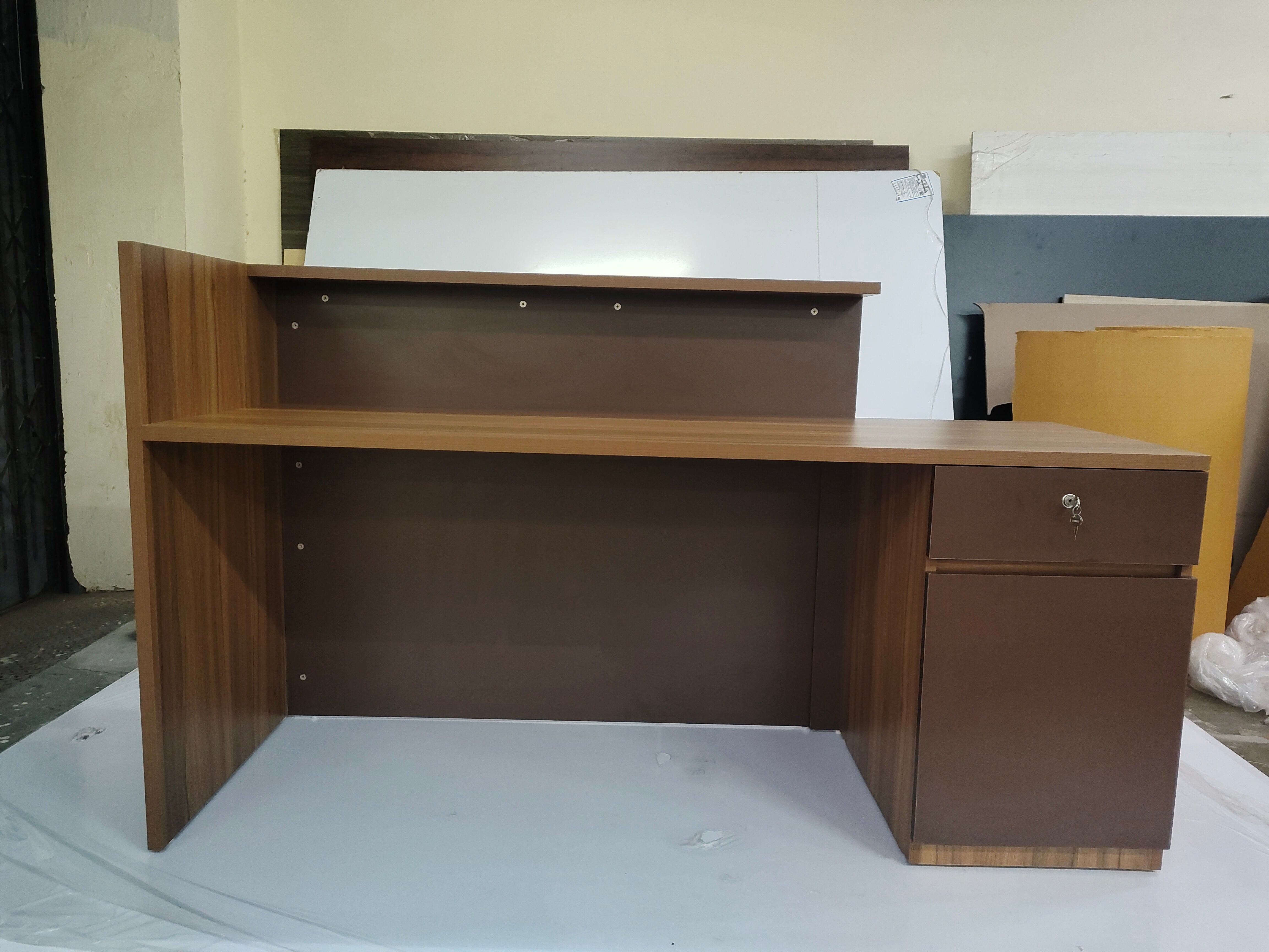 Reception Table Made In Engineered Wood with Matte Grey & King Walnut Laminate and Inlaid Brass Strip Detailing, Built In Storage