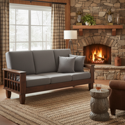 Cozy living room with a stone fireplace, gray sofa, and decorative items.