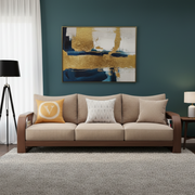 Living room with a brown sofa, decorative pillows, and abstract art on the wall.