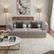 Modern living room with a gray sofa, coffee table, and decorative elements.