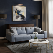 Modern living room with a blue sofa, coffee table, and abstract art on the wall.