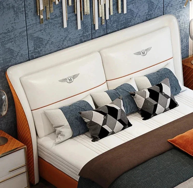 Grand Luxury King Size Upholstered Bed with Winged Padded Headboard, Metallic Crest Emblems, and Tan Accents – Available in Standard or Hydraulic Storage