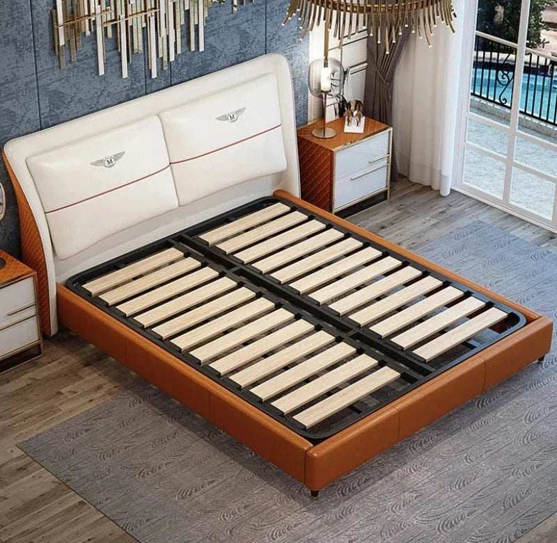 Grand Luxury King Size Upholstered Bed with Winged Padded Headboard, Metallic Crest Emblems, and Tan Accents – Available in Standard or Hydraulic Storage