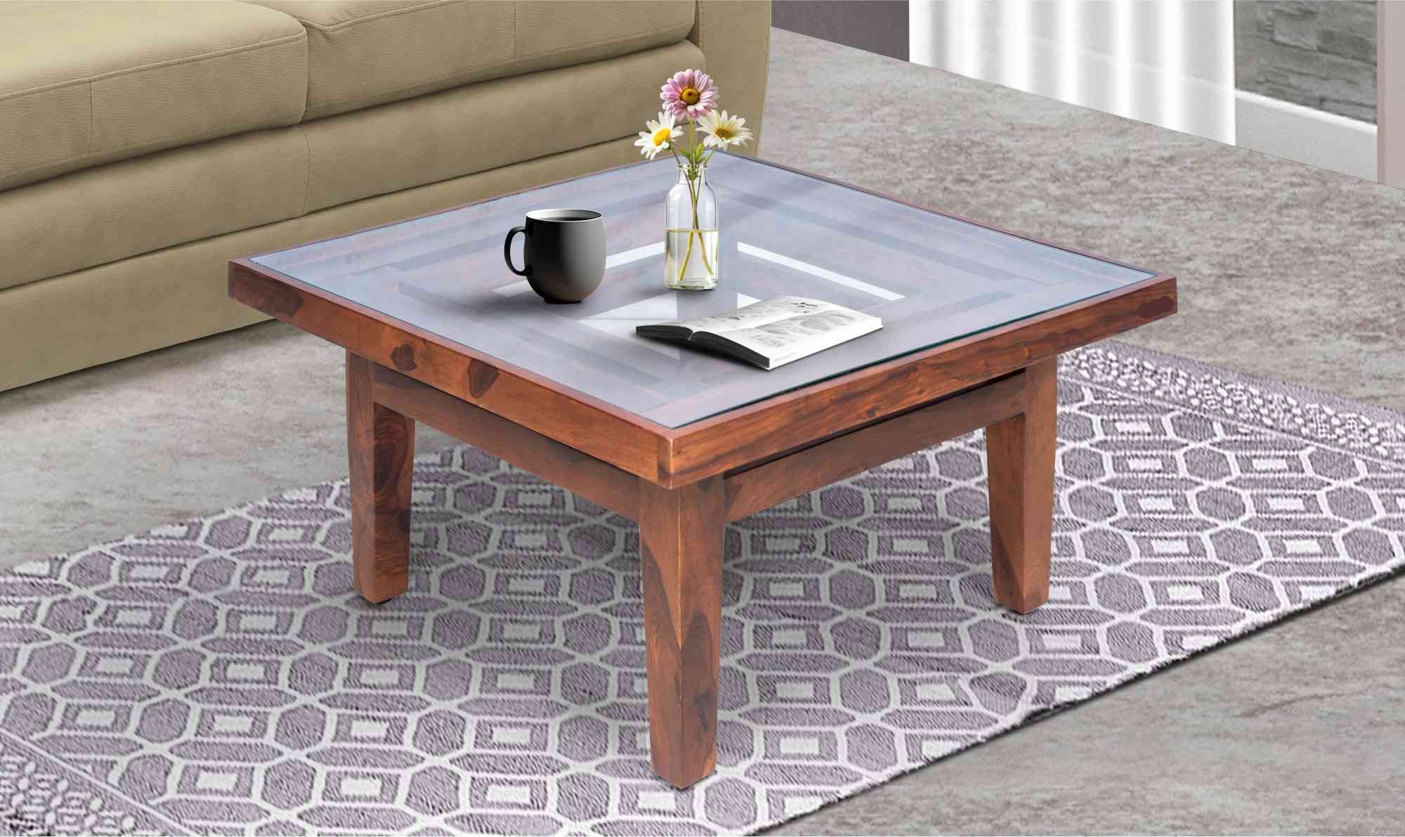 Center Table Featuring Glass Surface and Artistic Legs, Ideal for Sophisticated Living Room Settings