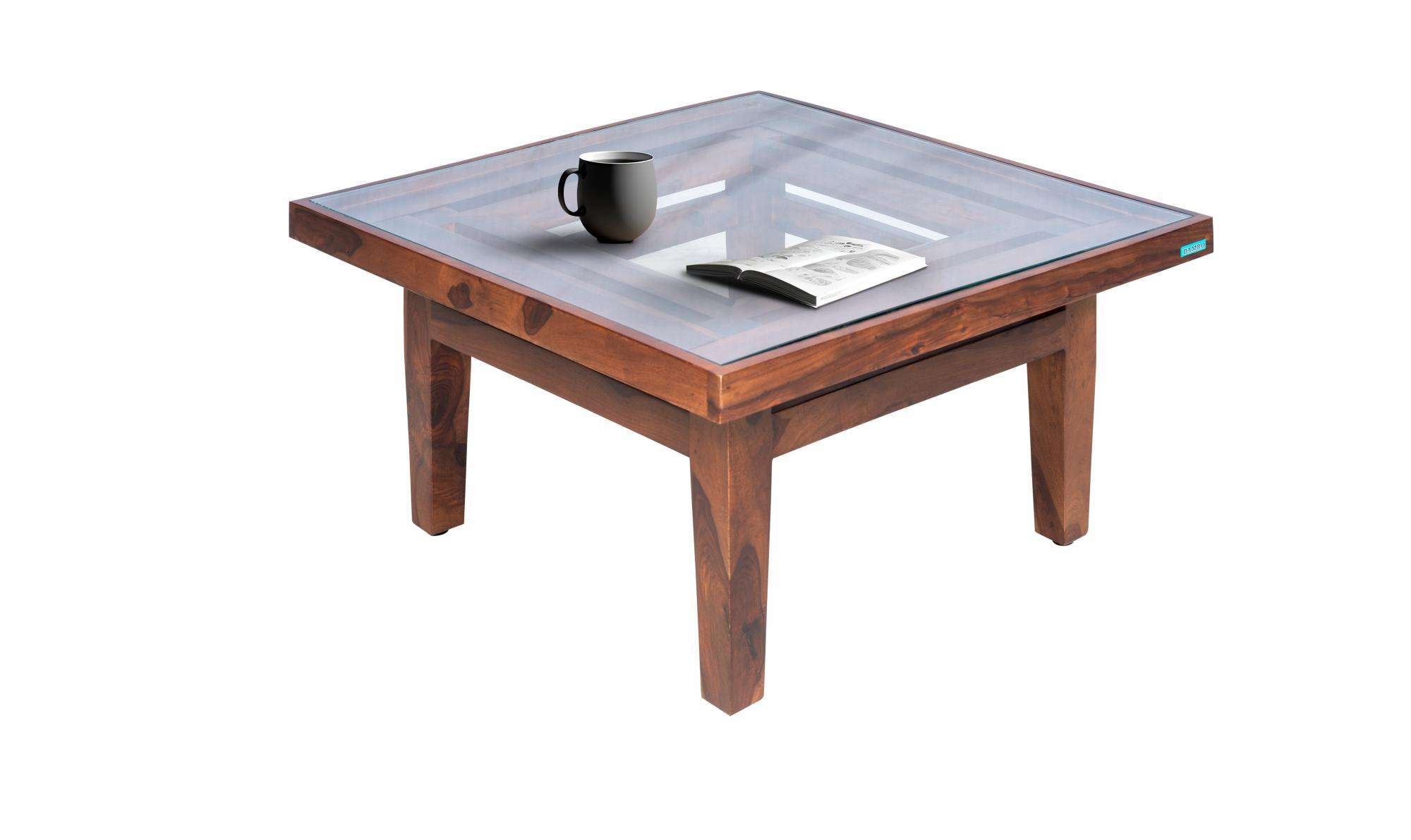 Center Table Featuring Glass Surface and Artistic Legs, Ideal for Sophisticated Living Room Settings