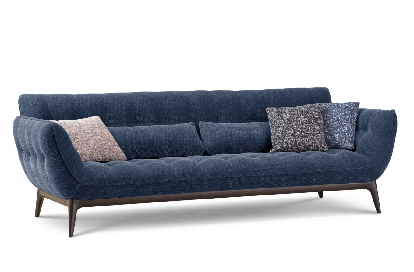 Blue sofa with cushions on a white background