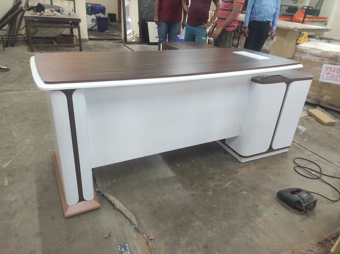 Director and Executive L shape Table Made in Plyboard with Veneer and high glossy finish.