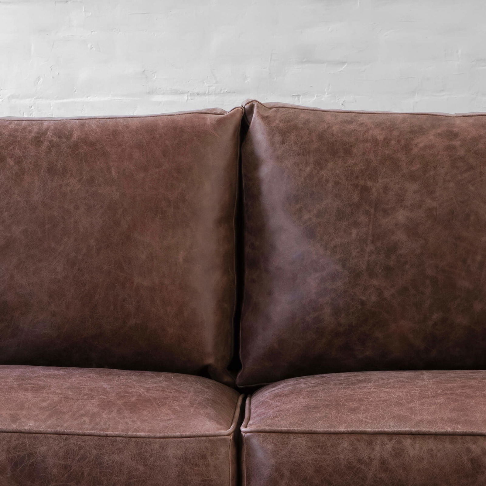 4 Seater Brown Sofa in Leatherette Upholstery Soft curved corners & slim armrest with Handcrafted Kiln-dried hardwood frame -