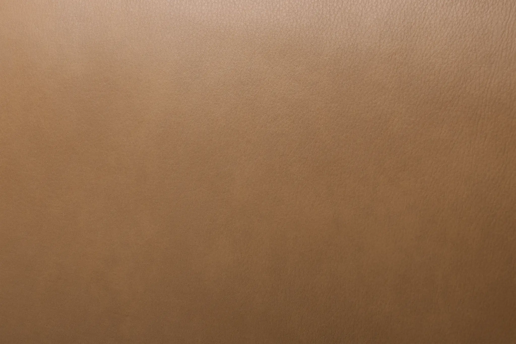 Premium brown top-grain leather over a sturdy engineered frame with a solid wood base and plush foam cushioning