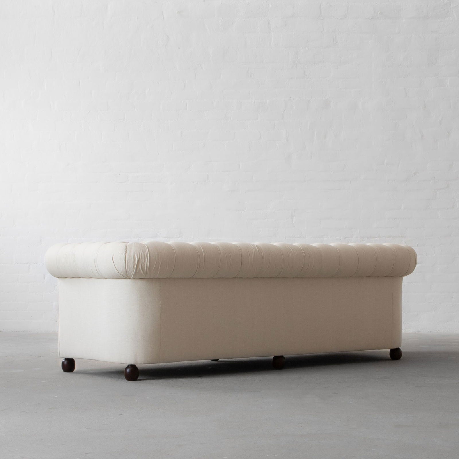 Four Seater Fabric Cotton Line Blend Sofa with hardwood frame Solid legs in black matte finish. -