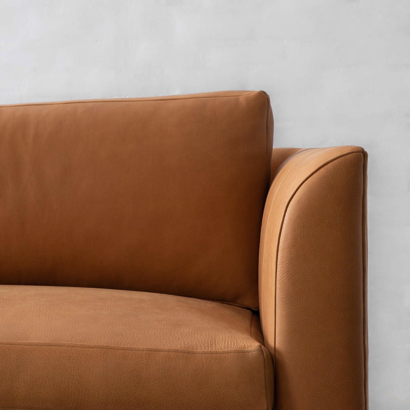 Four Seater Leatherette Sofa with hardwood frame Solid metal legs in black matte finish. -