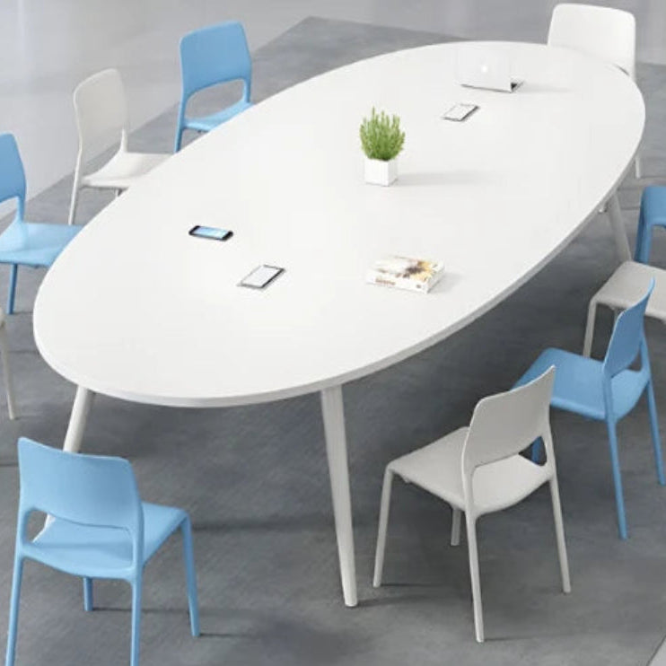 Oval conference table with blue and white chairs in a modern office setting