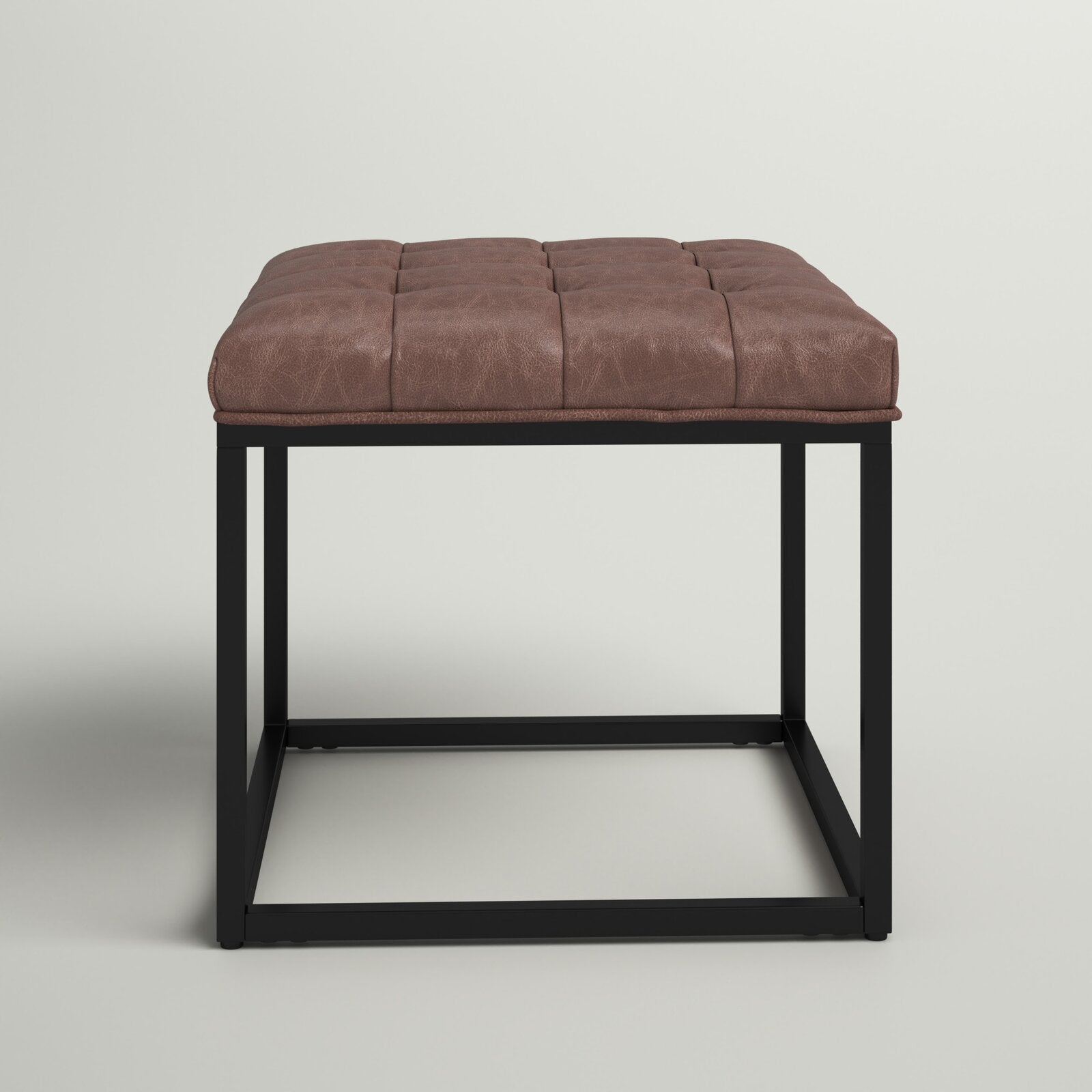 लेदरेट अपहोल्स्ट्री और मेटल बेस ओटोमन