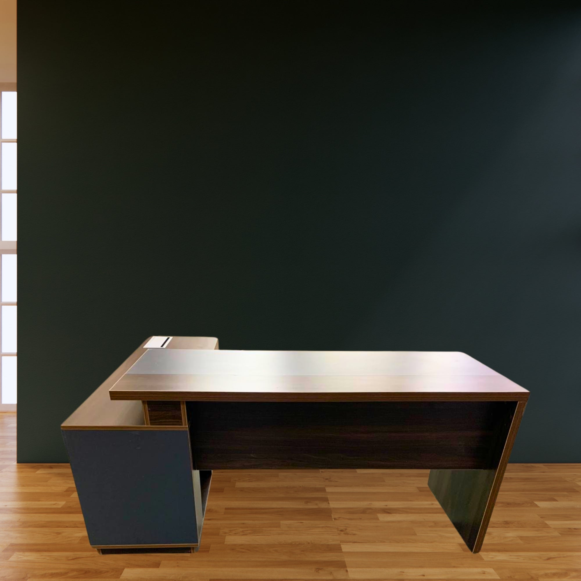 Wooden office desk against a dark wall