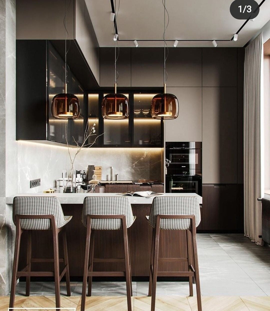 Contemporary Kitchen Featuring Dark Tones and Amber Lighting