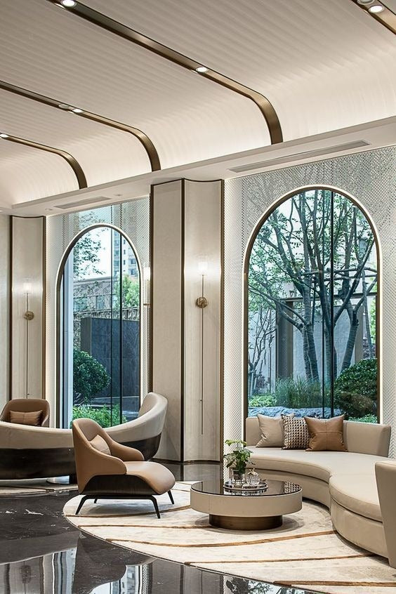 Dramatic Barrel Vault False Ceiling with Lighting and Bronze Accents