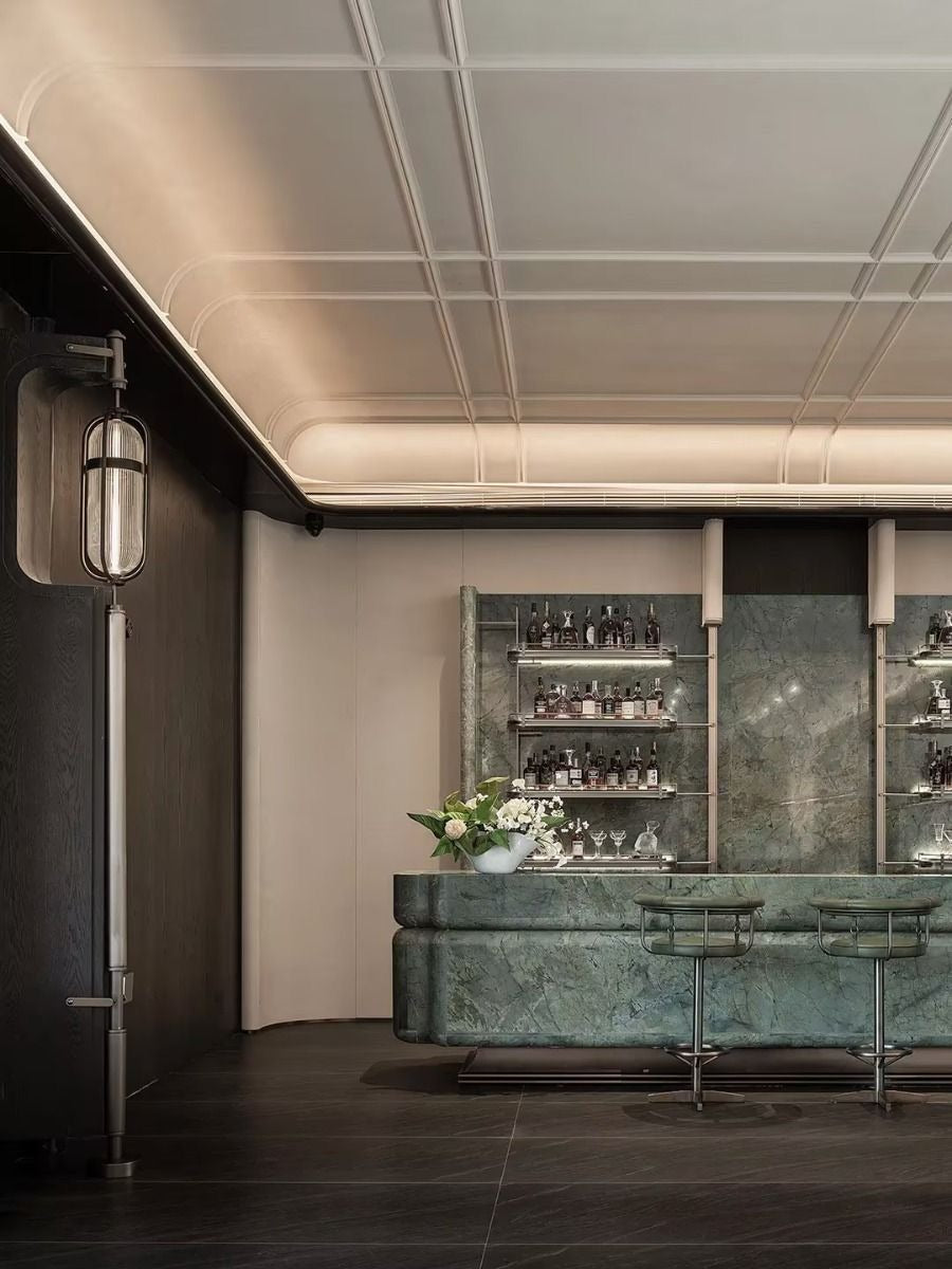 Sleek False Ceiling with Illuminated Convex Panels and Cove Lighting