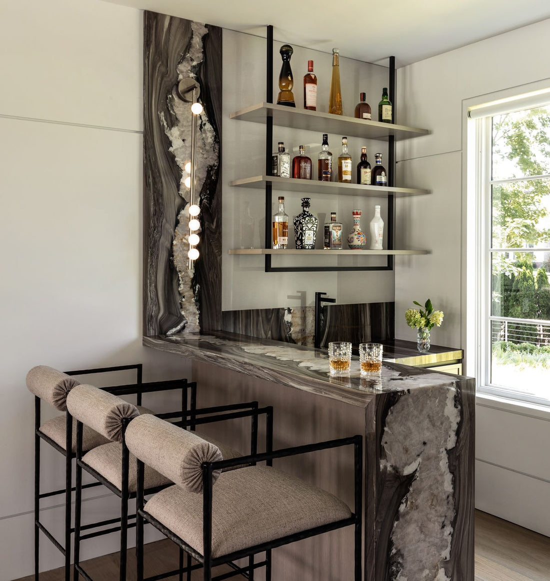 Luxurious Marble Home Bar with Open Shelves and Modern Seating