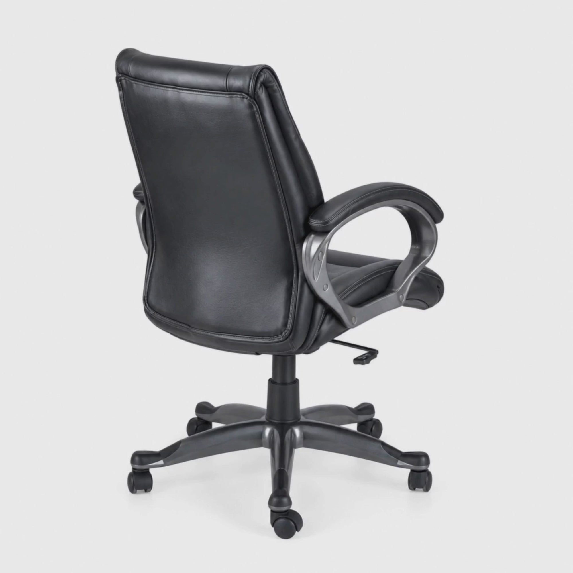 Load video: Executive Mid Back Office Chair with Premium Leatherette Upholstery, Cushioned Seat, Curved Armrests, Adjustable Height &amp; Swivel Base for Office