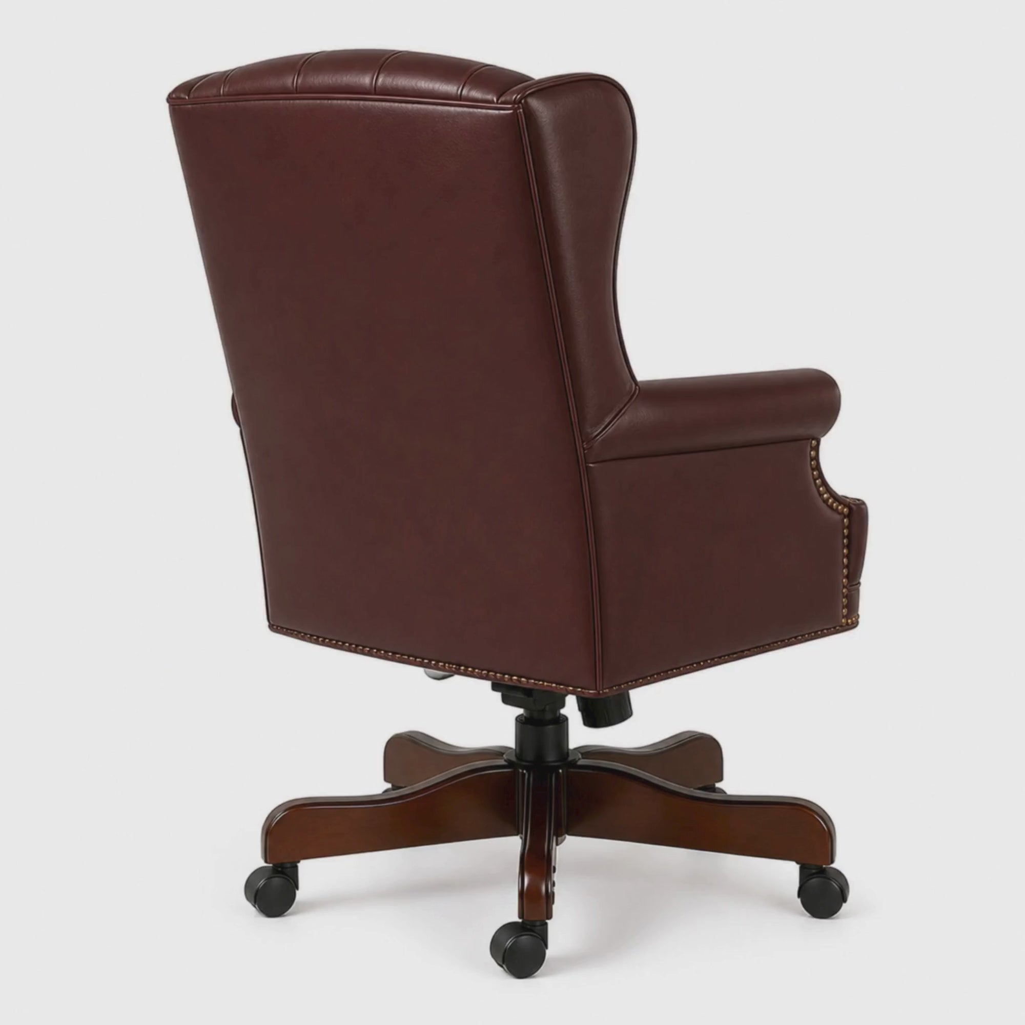 Load video: Luxury Wingback Swivel Chair with Wooden Base and Classic Tufted Style Director Desk Chair